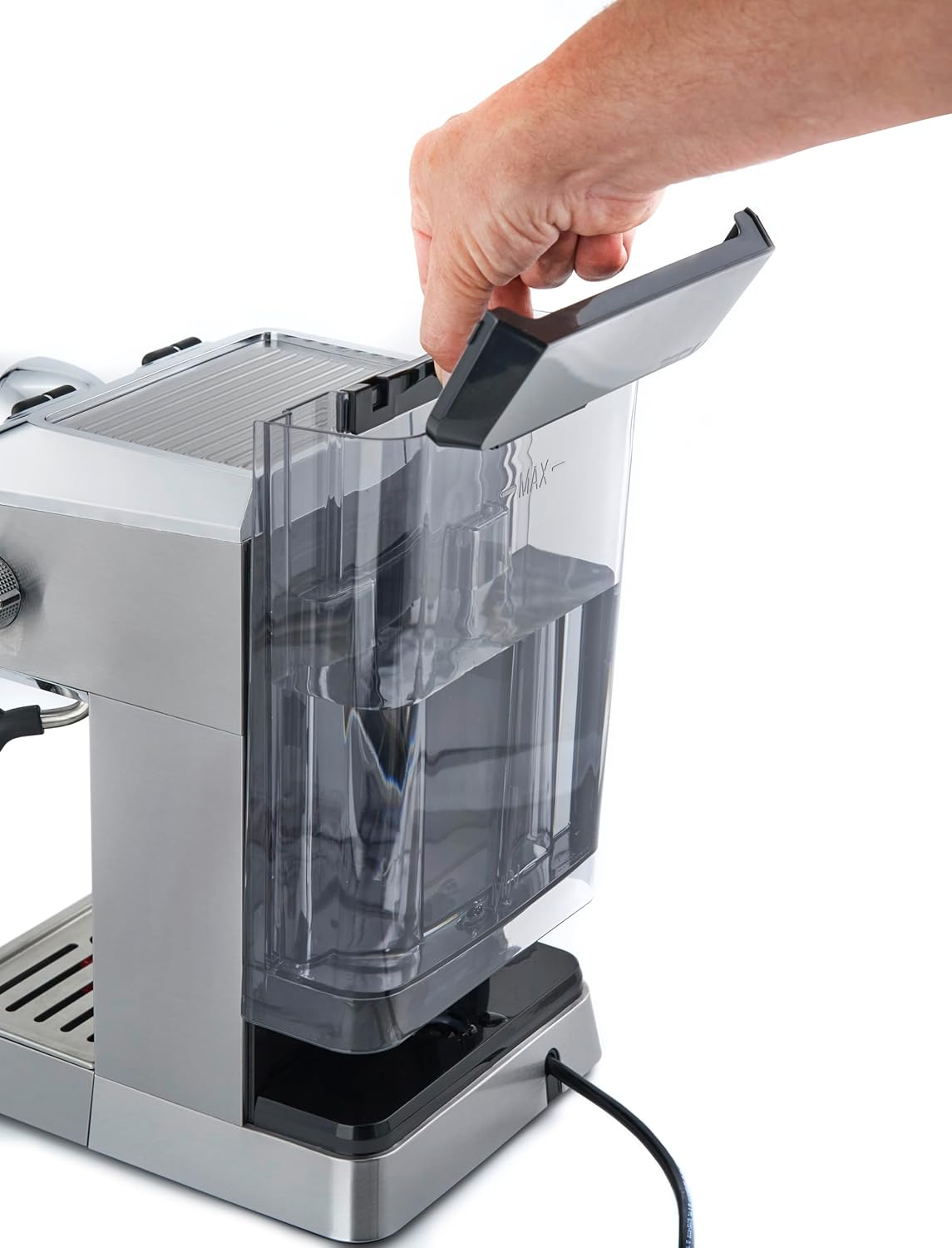 Hand removing the water tank from the Caso Espresso Gourmet machine.