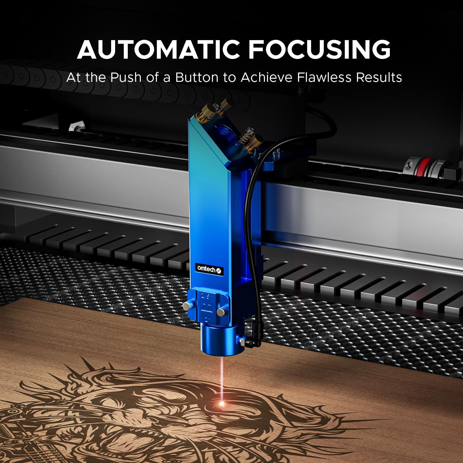 Close-up of the OMTech Pro laser head with a red laser dot on a wooden surface, indicating automatic focusing for precise engraving.
