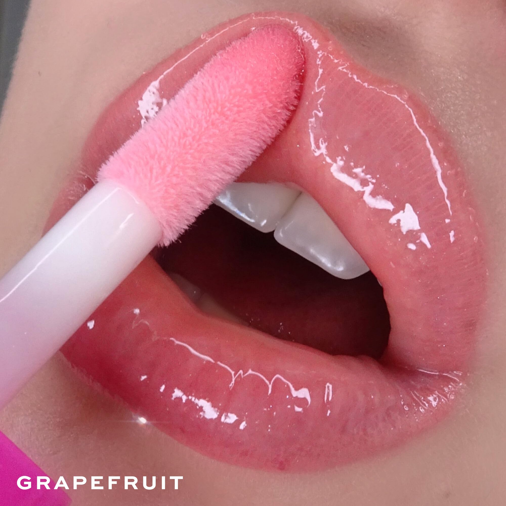 REVOLUTION JUICY POUT LIP GLOSS GRAPEFRUIT