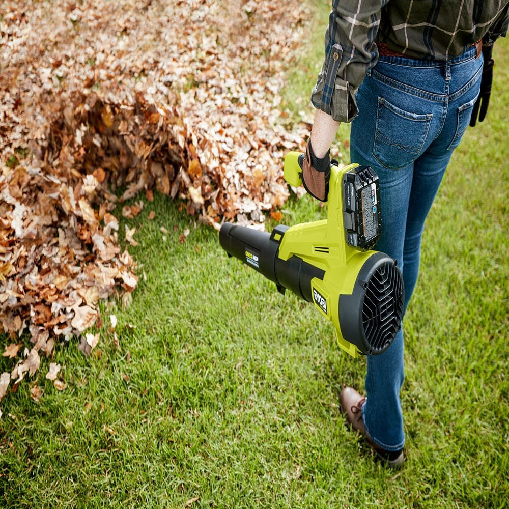 Person using RYOBI ONE+ HP 18V Brushless Cordless Leaf Blower