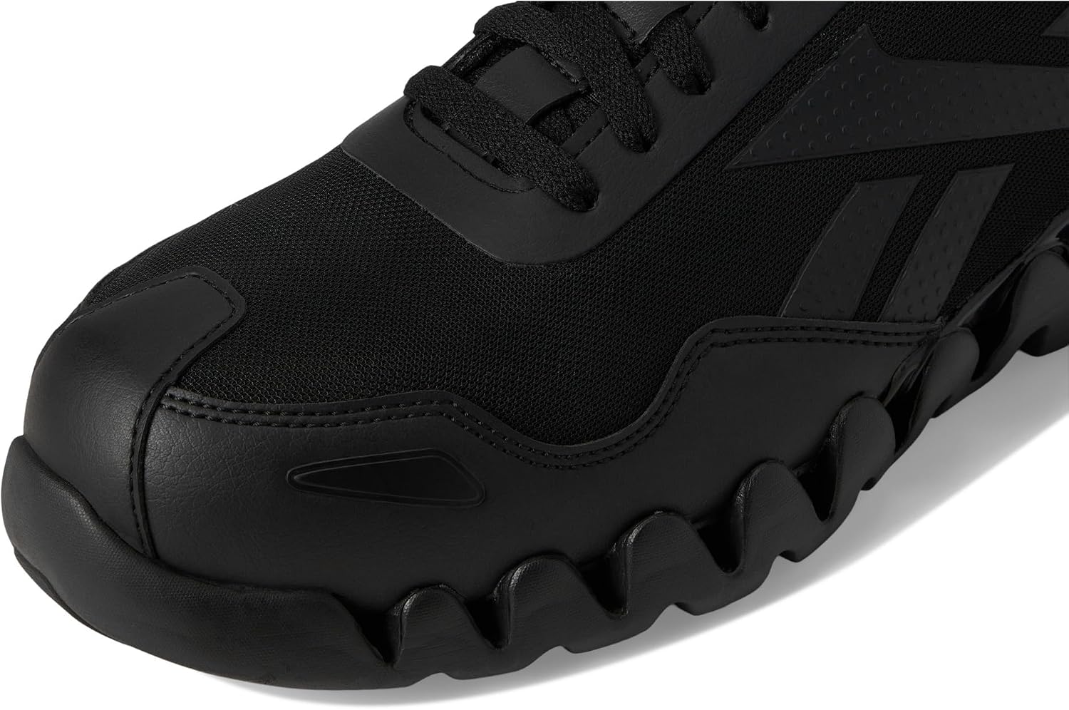 Close-up of the Reebok logo and mesh texture on the side of the RB3019 shoe