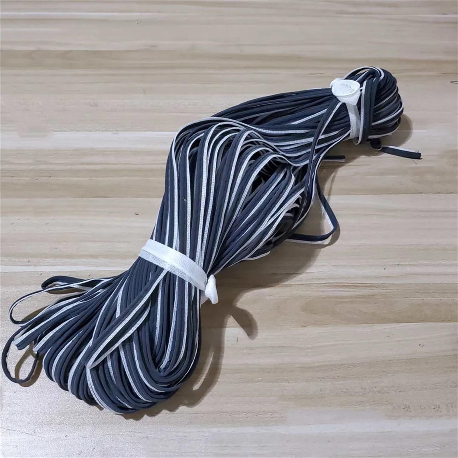 cinta reflectante para ropa, Cinta reflectante negra con borde blanco for coser, 100 yardas