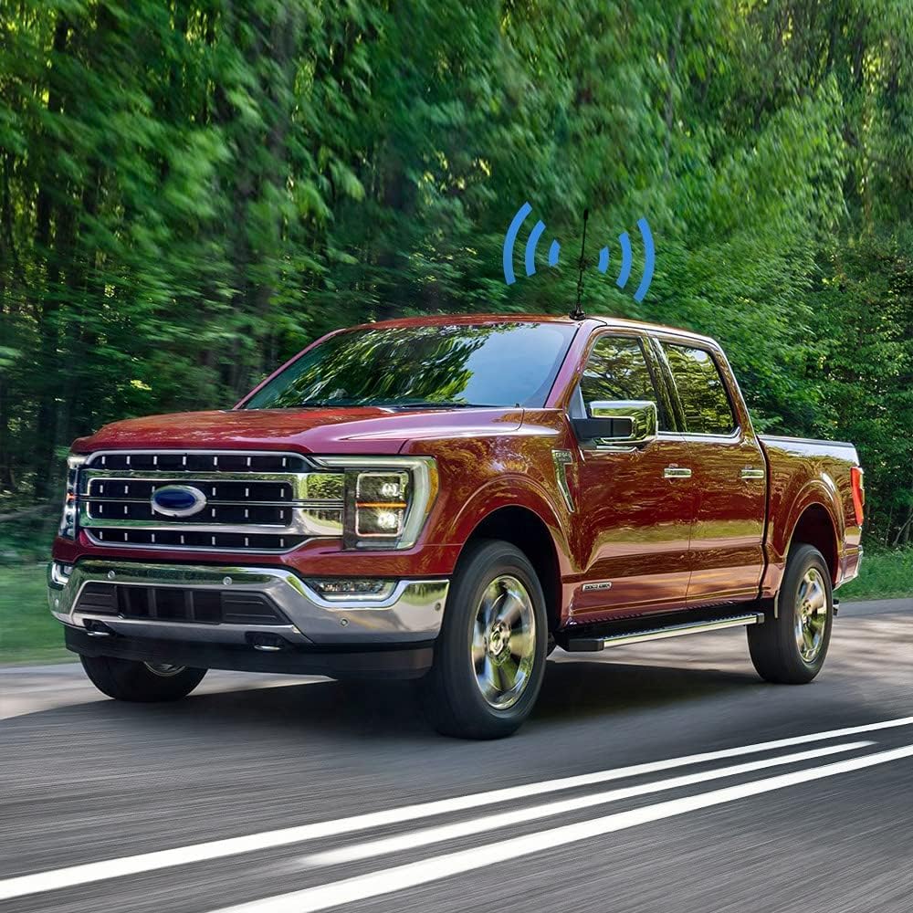 Bingfu antenna mounted on the roof of a moving red pickup truck, with blue signal waves emanating from it.