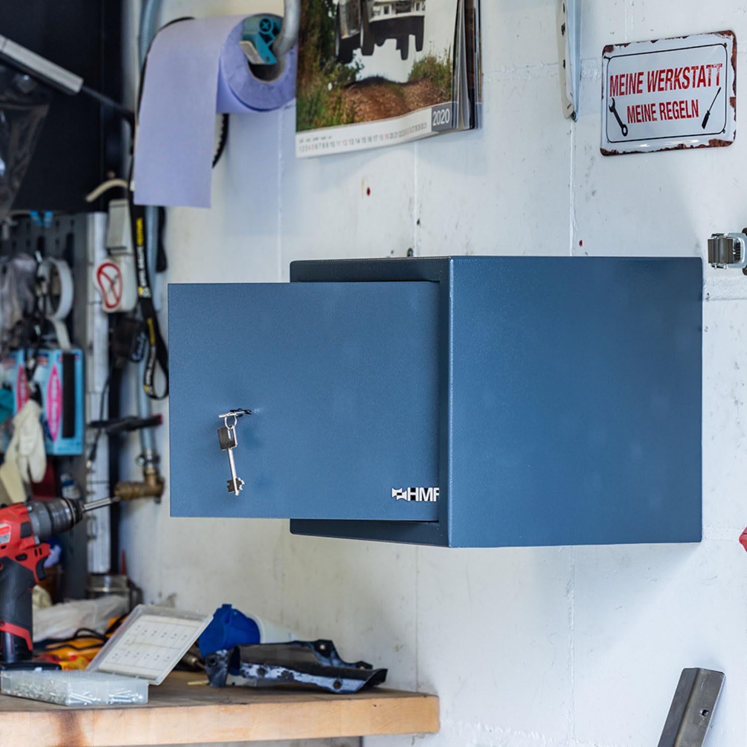 HMF safe securely mounted to a wall in a workshop