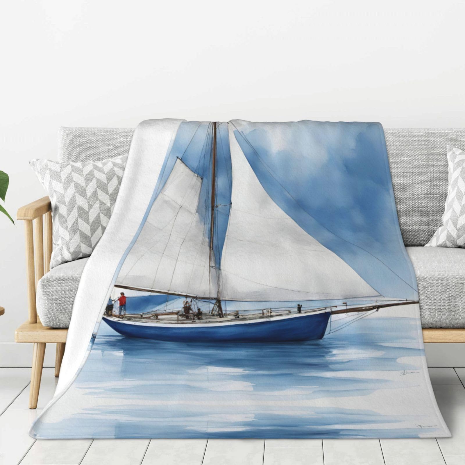 Couverture douce contre le froid nocturne avec son motif voilier bleu réconfortant