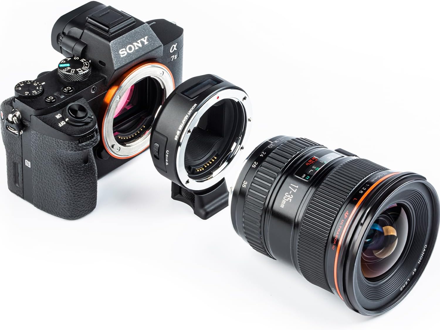 Dibongkar view of a Sony E-mount camera, the VILTROX EF-E5 lens adapter, and a Canon EF lens, illustrating the connection points for assembly.