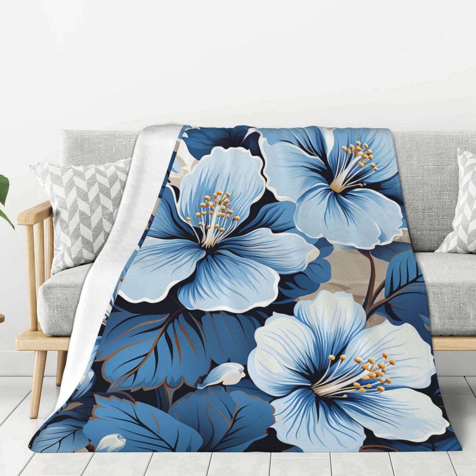 Plaid en flanelle douce bleu hibiscus pour vos moments cocooning sur le canapé