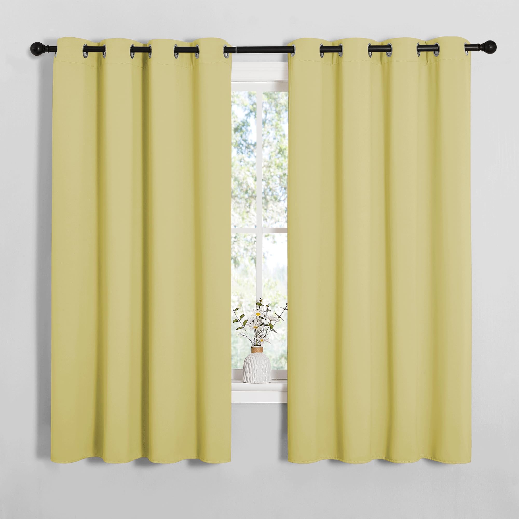 NICETOWN Bedroom Curtain Panels Blackout Draperies, Thermal Insulated Solid Grommet Blackout Curtains/Drapes (Paler Yellow, 1 Pair, 55 by 68-inch)
