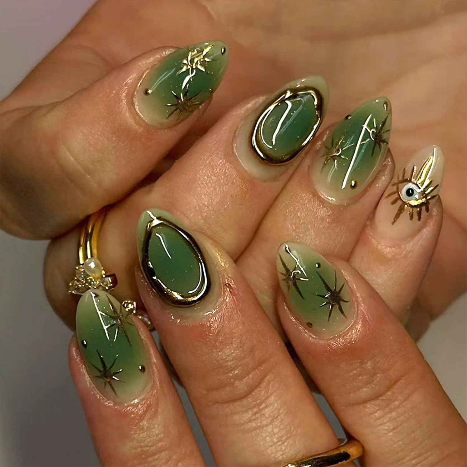 24Pcs Gold Star Press on Nails Short Almond Fake Nails with Eye Green Glossy Design Gilded False Nails Full Cover Artificial Glue on Nails Summer