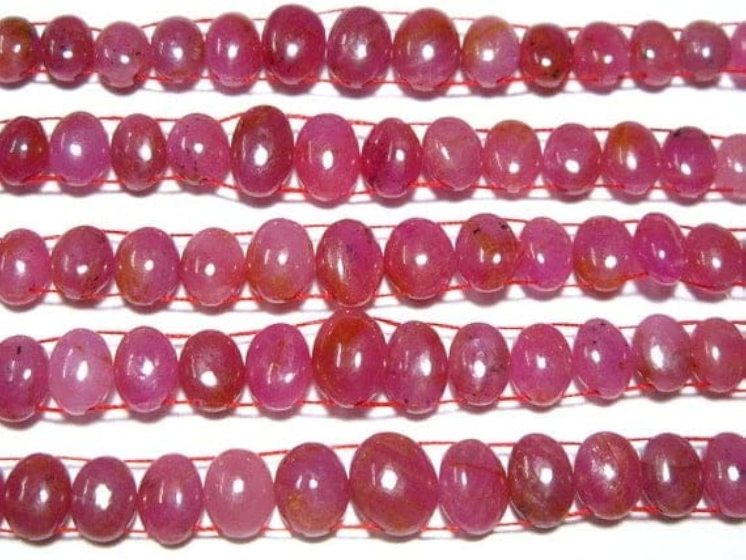 Rubis AAA perles ovales lisses pour éviter les défauts d'alignement sur vos colliers