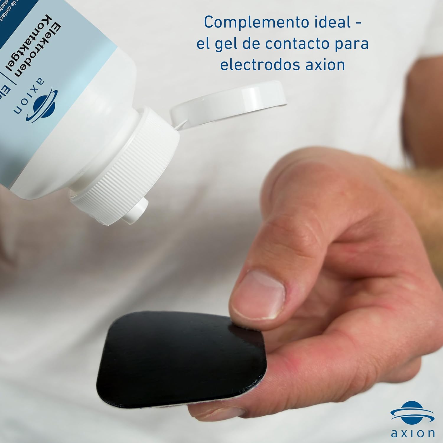 Image showing a hand applying contact gel to an axion electrode, indicating it as an ideal complement for improved conductivity.