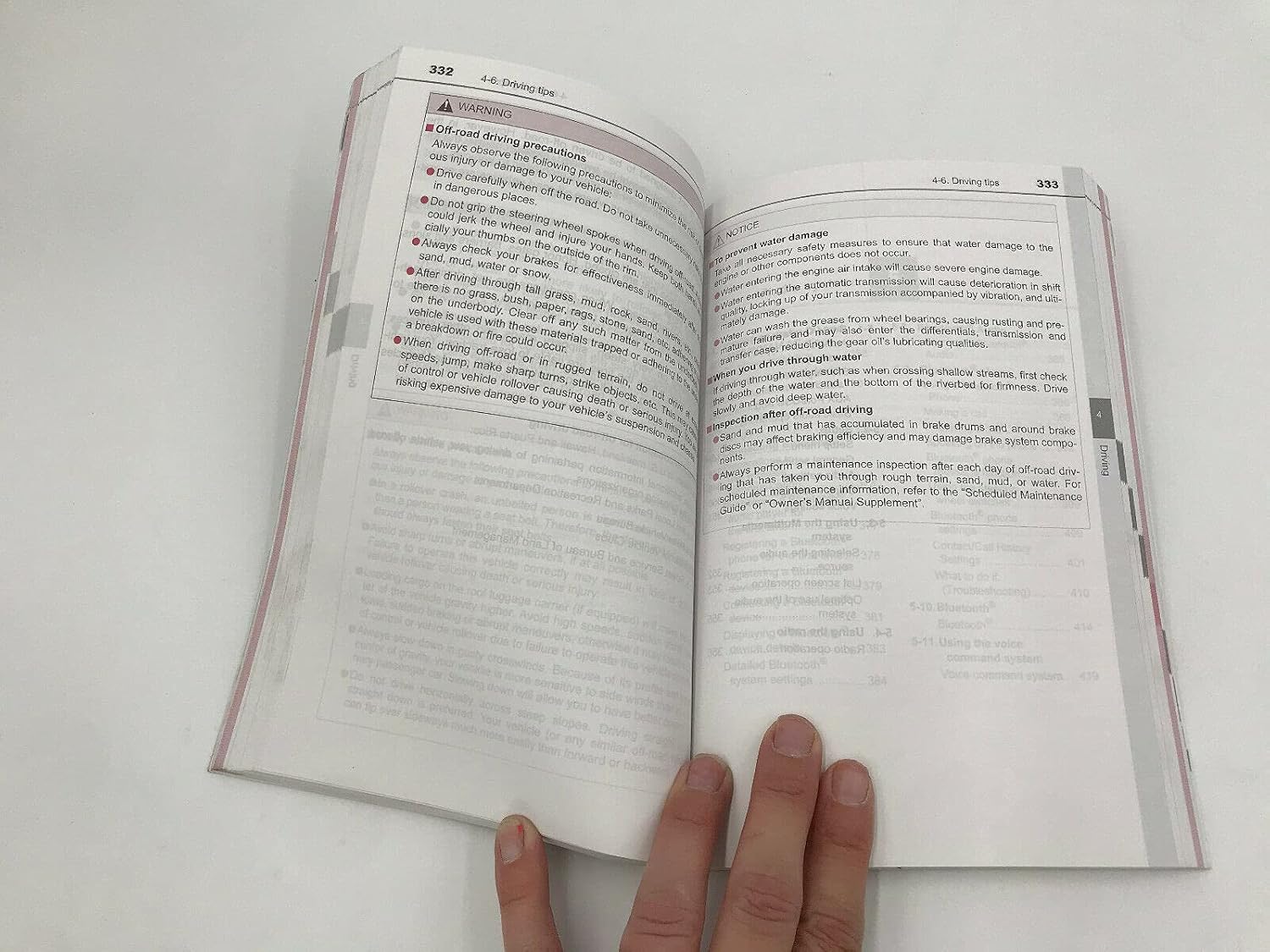 Manual page with off-road driving precautions and water damage prevention