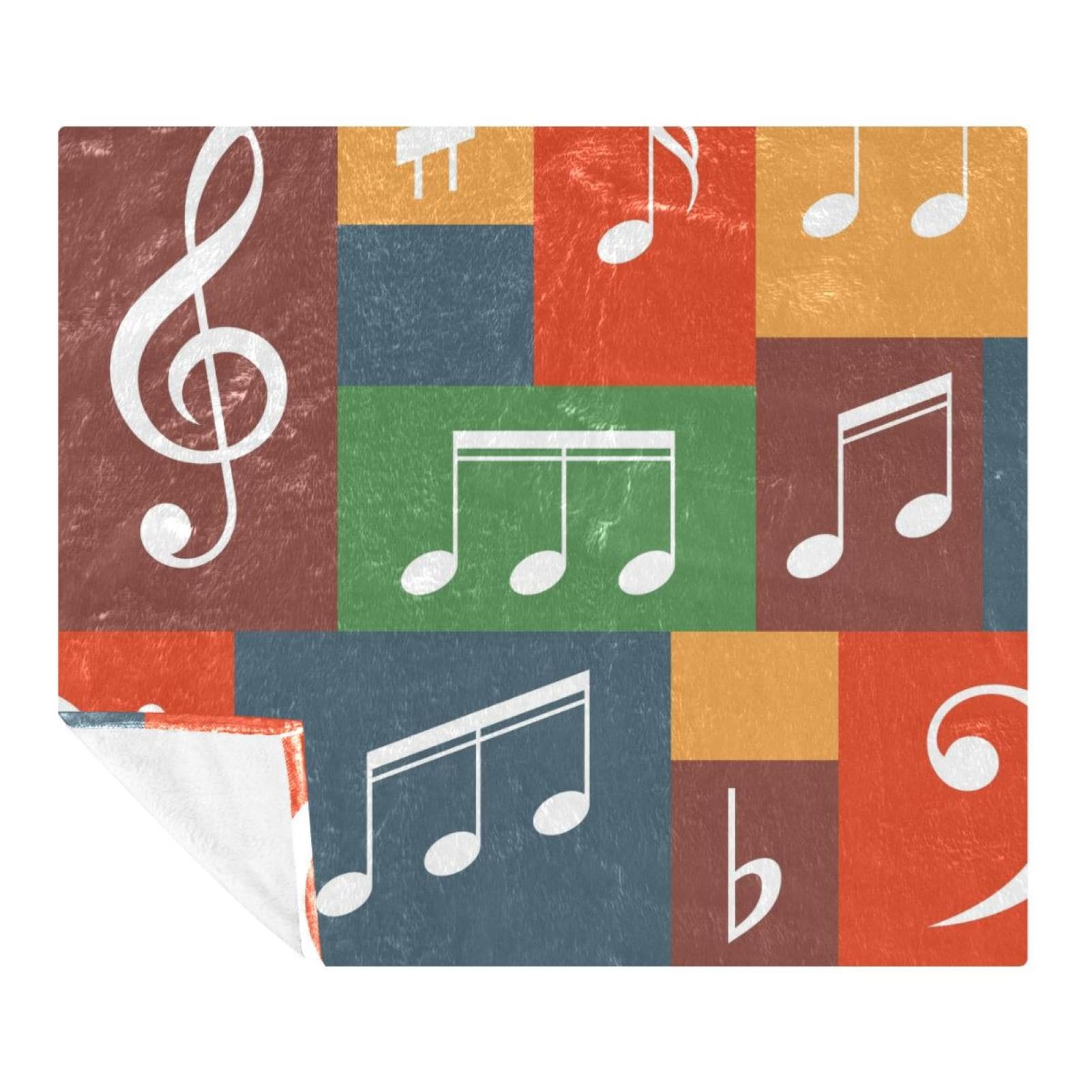 Couverture douce notes de musique sur grille colorée : un écrin de tendresse pour vos enfants
