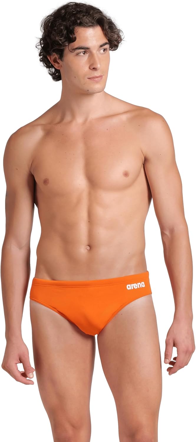ARENA Men’s Team Solid Swim Brief MaxLife Athletic Swimwear Professional Training Swimsuit Sports Bathing Suit, Team Orange, US Size 36