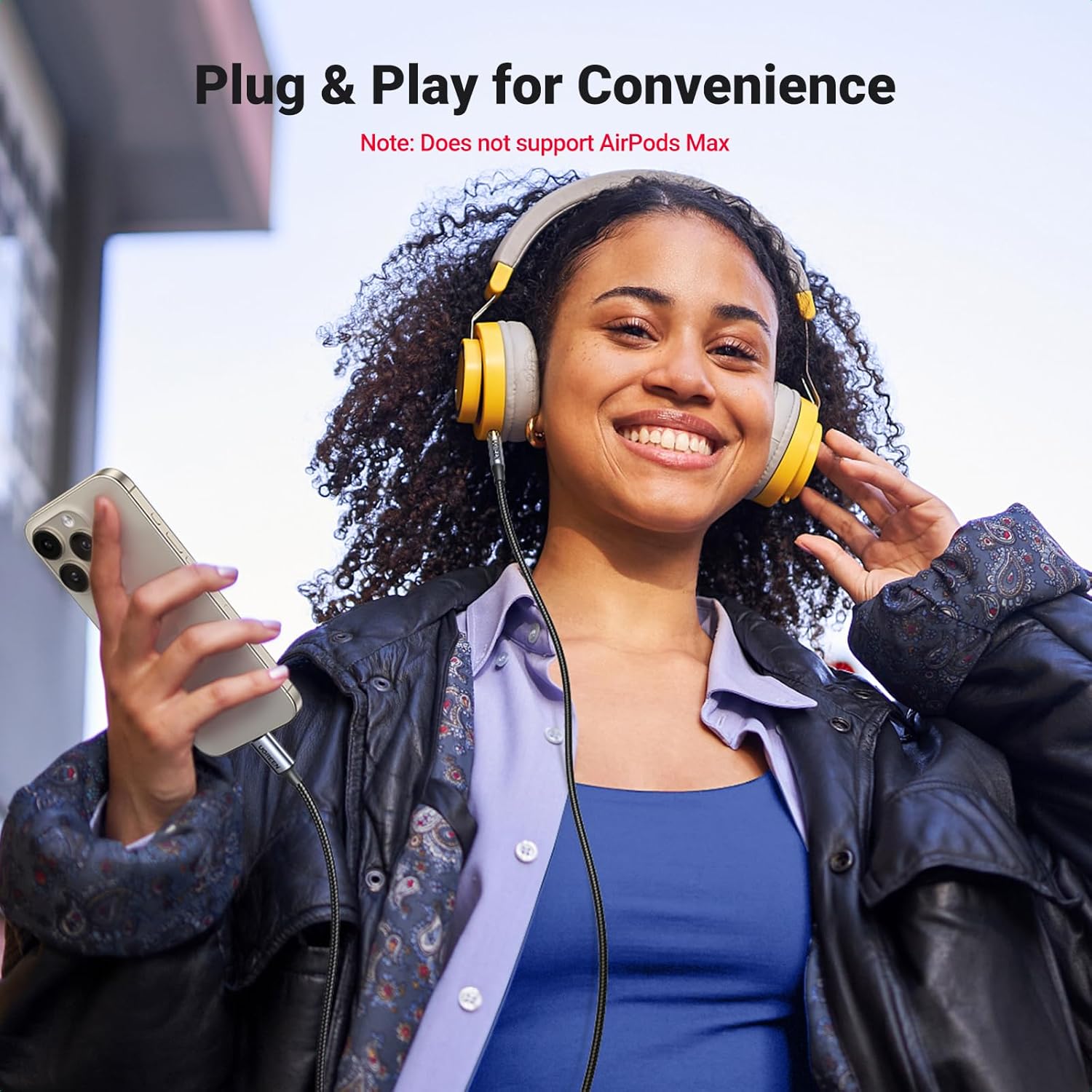 Person using headphones with UGREEN adapter