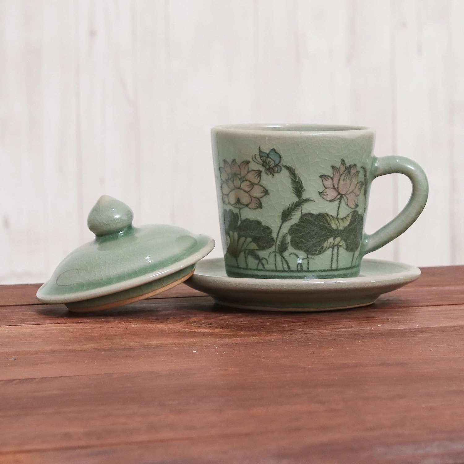 NOVICA Artisan Handmade Celadon Ceramic Cup Saucer Glazed Floral from Thailand Green Tableware Dinnerware Mugs Cups Animal Themed Butterfly [cups 4.7in H x 4.3in W x 3.7in D 5 Oz. Saucers 0.7in H x 5]