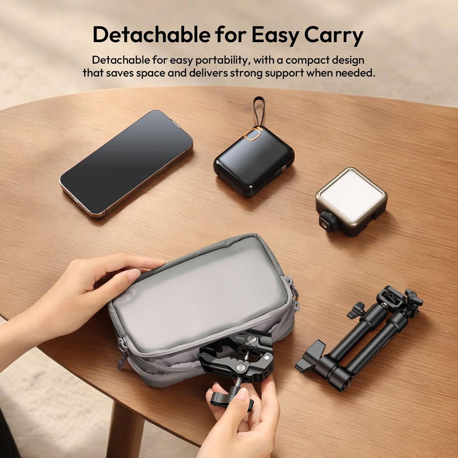 ULANZI HD02 Magic Arm and Super Clamp disassembled and packed into a small pouch, demonstrating portability