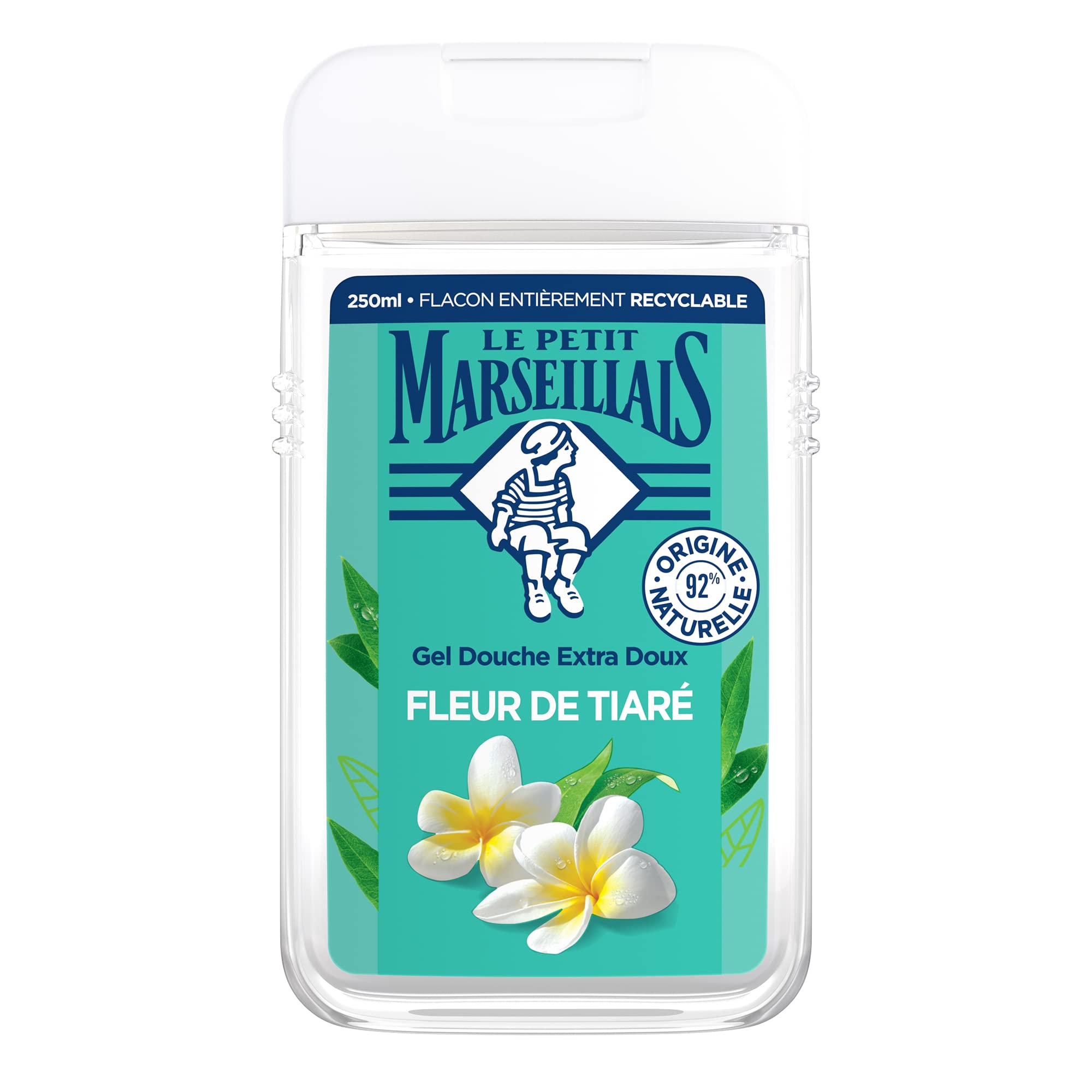 Gros plan sur la texture mousseuse et le flacon du gel douche Le Petit Marseillais Fleur de Tiaré.