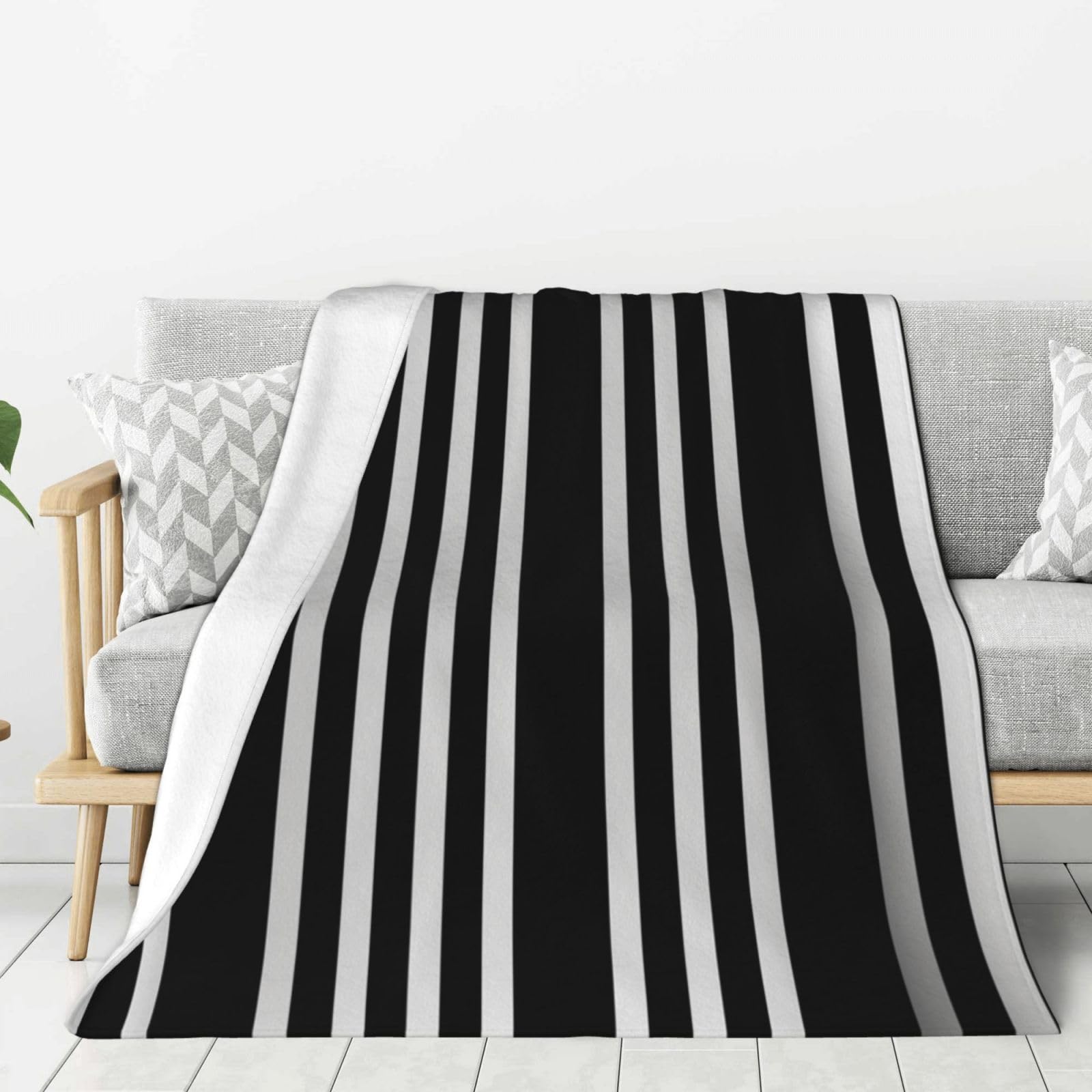 Couverture polaire flanelle légère pour voyage et soirées cocooning sur le canapé