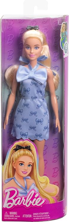 Barbie Fashionistas doll, with her blue dress with bow and front tie, black hairpin with bow and matching blue heels, her blonde hair gathered in a ponytail, HYT93