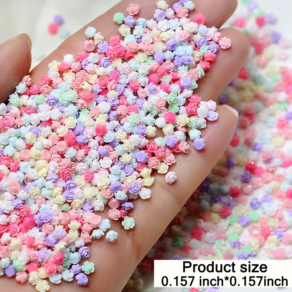 View 1 of 100Pcs Random Mixed Colors 4mm Tiny Flower Nail Charms Flatback 3D Flowers for Nails Design Colorful Camellia Rose Nail Flowers Mini Resin Flower Charms for Nails Supplies Manicure Accessories