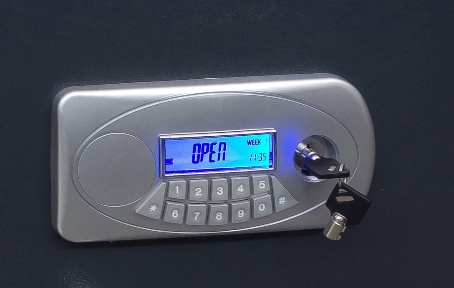 Close-up of ARREGUI safe electronic keypad with 'OPEN' displayed and emergency key