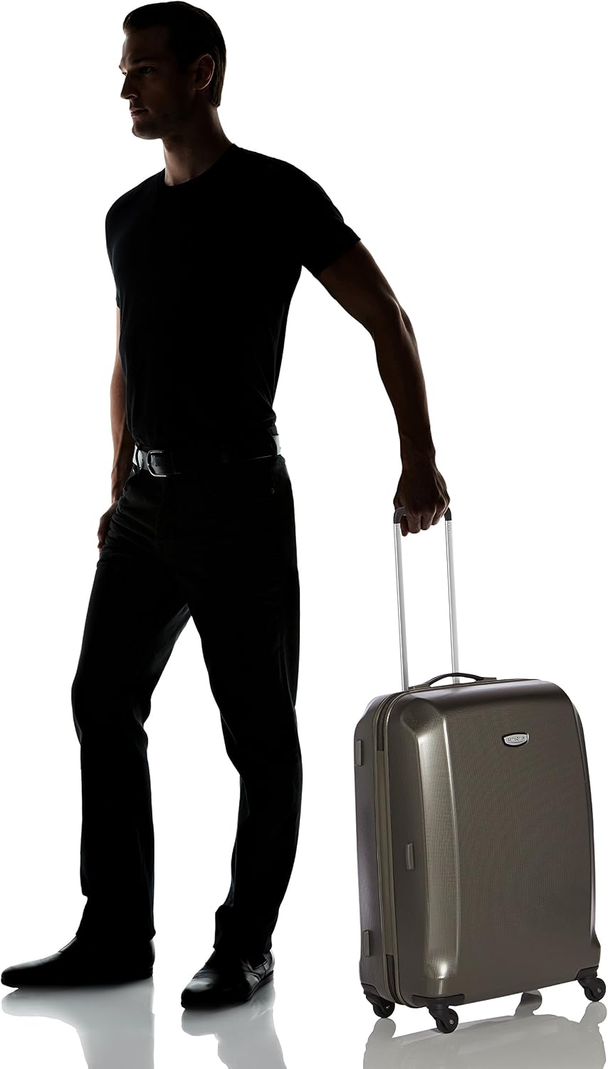 Samsonite Skydro Spinner 69/25 Suitcase next to a person for size comparison