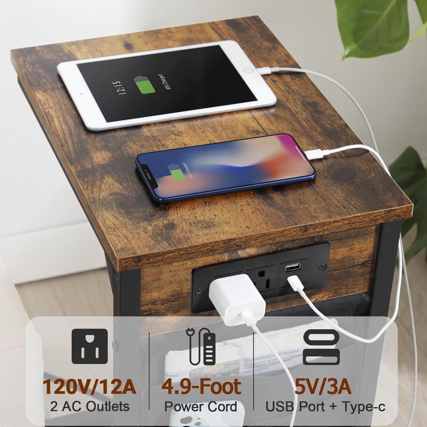 Close-up of the charging station on the tabletop, showing two AC outlets and two USB ports (USB-A and USB-C) with devices plugged in.
