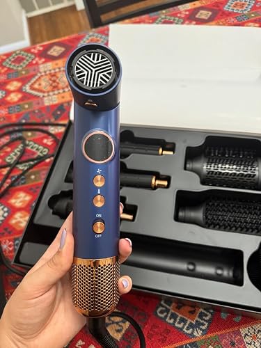 Review Image by It's powerful, strong, dries my hair much faster than my old hair dryer, easy to hold because it's so light, it prevents frizz when drying my hair and makes my hair look shinier and healthier. Thanks to the different temperature and speed settings, I can blow dry my hair according to my hair type.