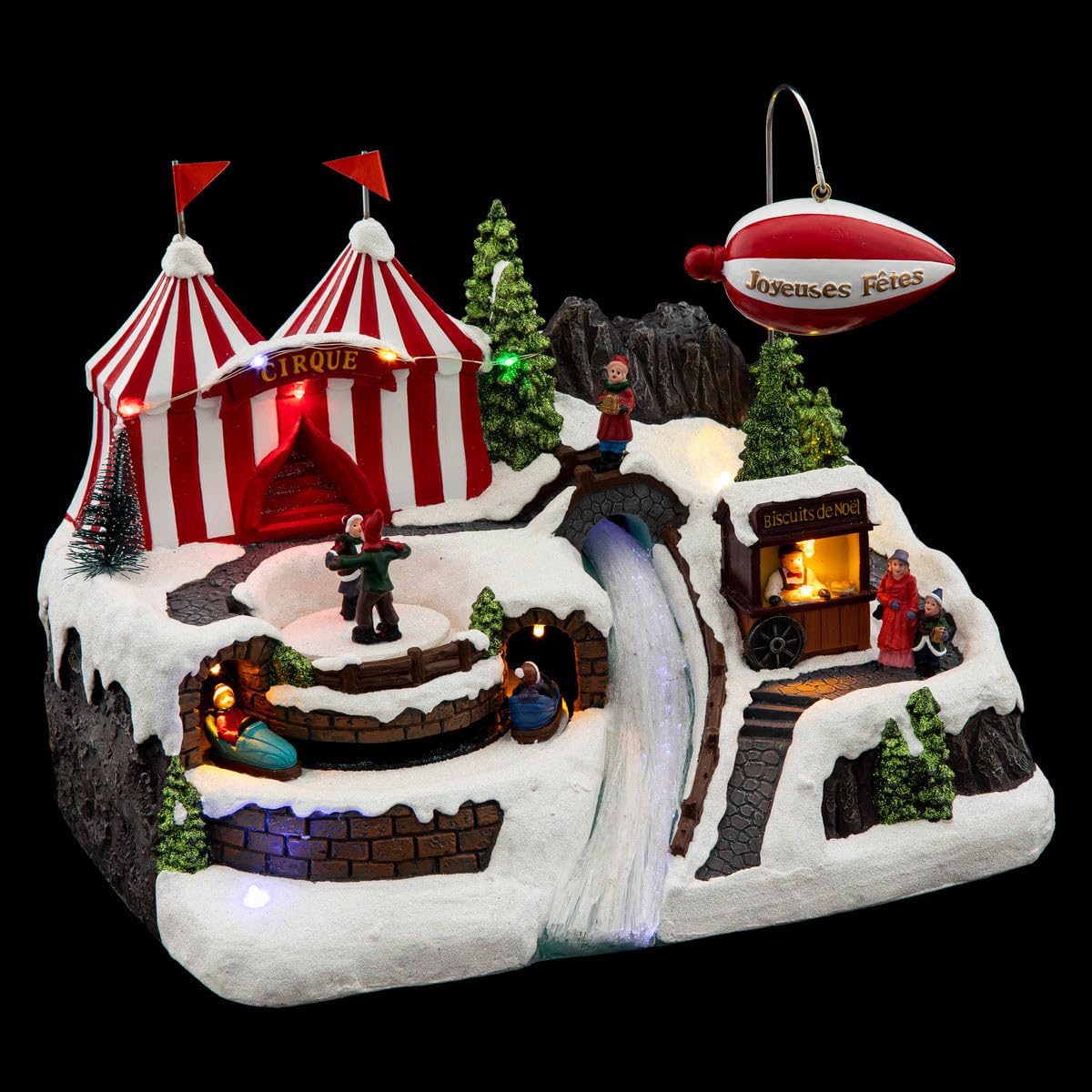 FEERIC LIGHTS & CHRISTMAS Pueblo de Navidad dirigible Animado/Musical 12 LED + Transformador