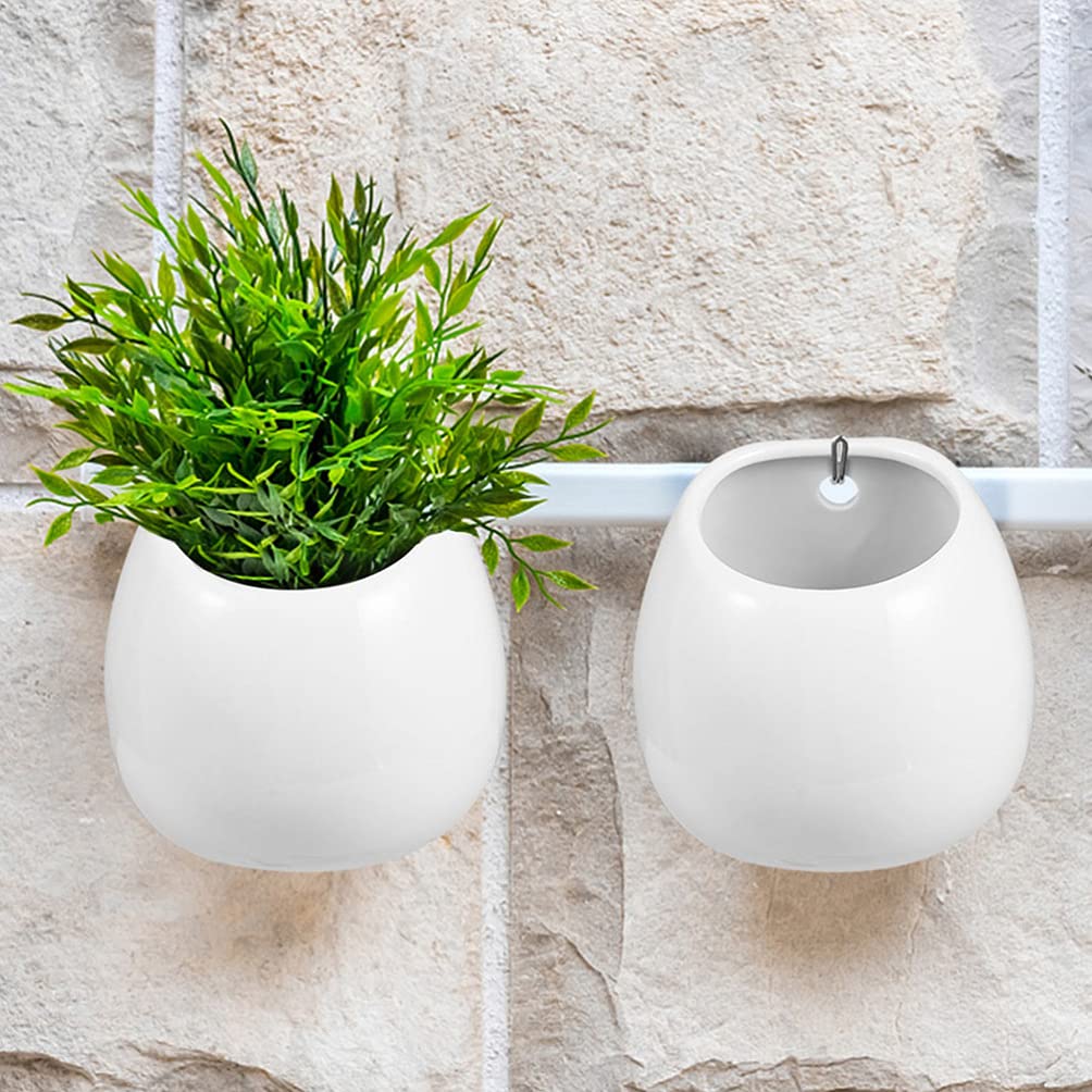 Białe ceramiczne doniczki ścienne, okrągłe wiszące uchwyty na rośliny, mini wazony ścienne do sukulentów, wewnętrzne donice cylindryczne, dekoracyjne dekoracje ścienne.