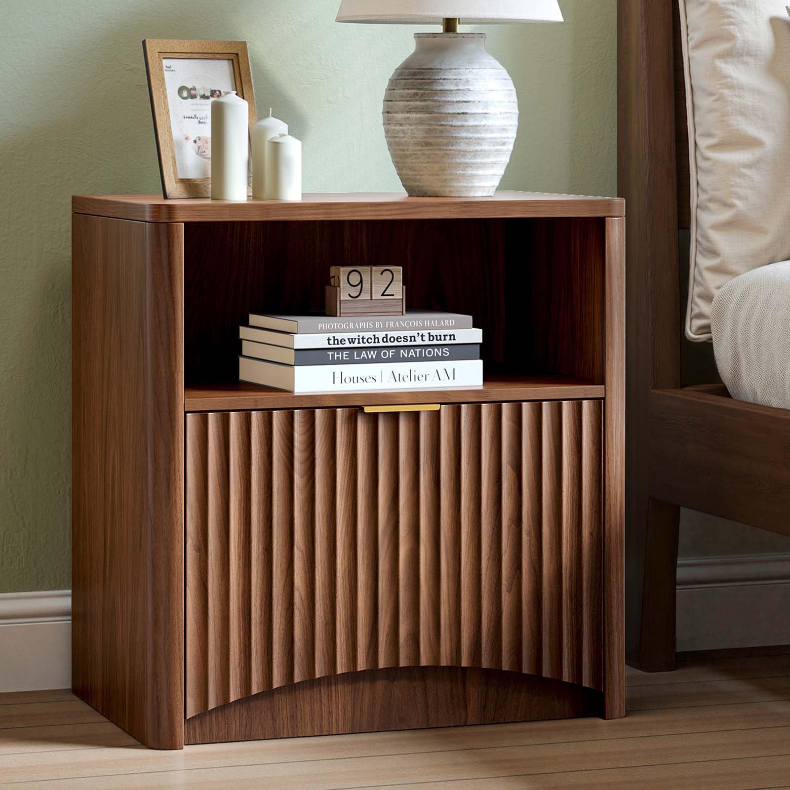 The Evermagin Fluted Nightstand in walnut finish, featuring an open shelf and a drawer with a fluted front panel and gold handle.