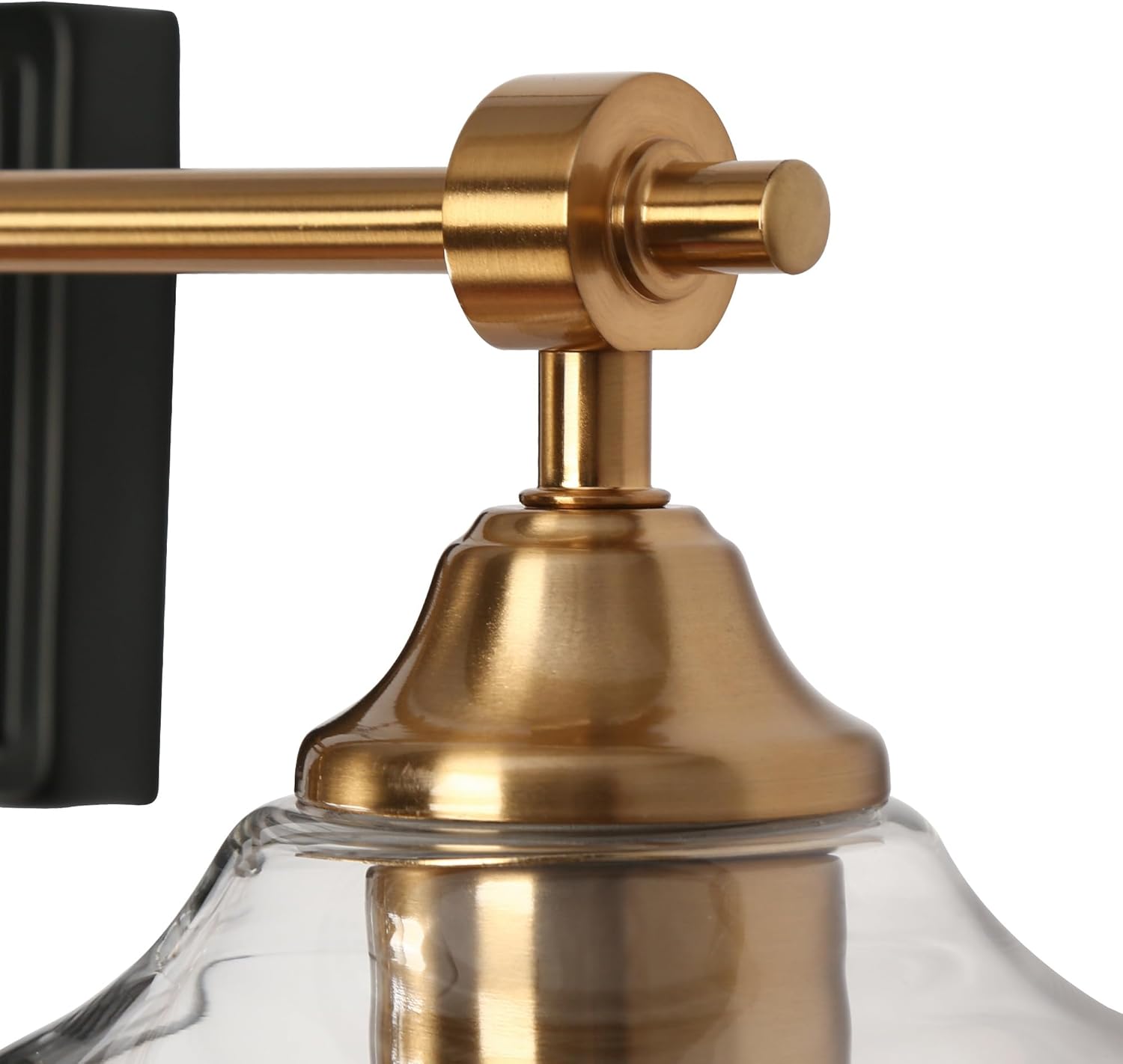 Close-up of the KSANA light fixture's mounting hardware and base, showing the black rectangular canopy and brass bar.