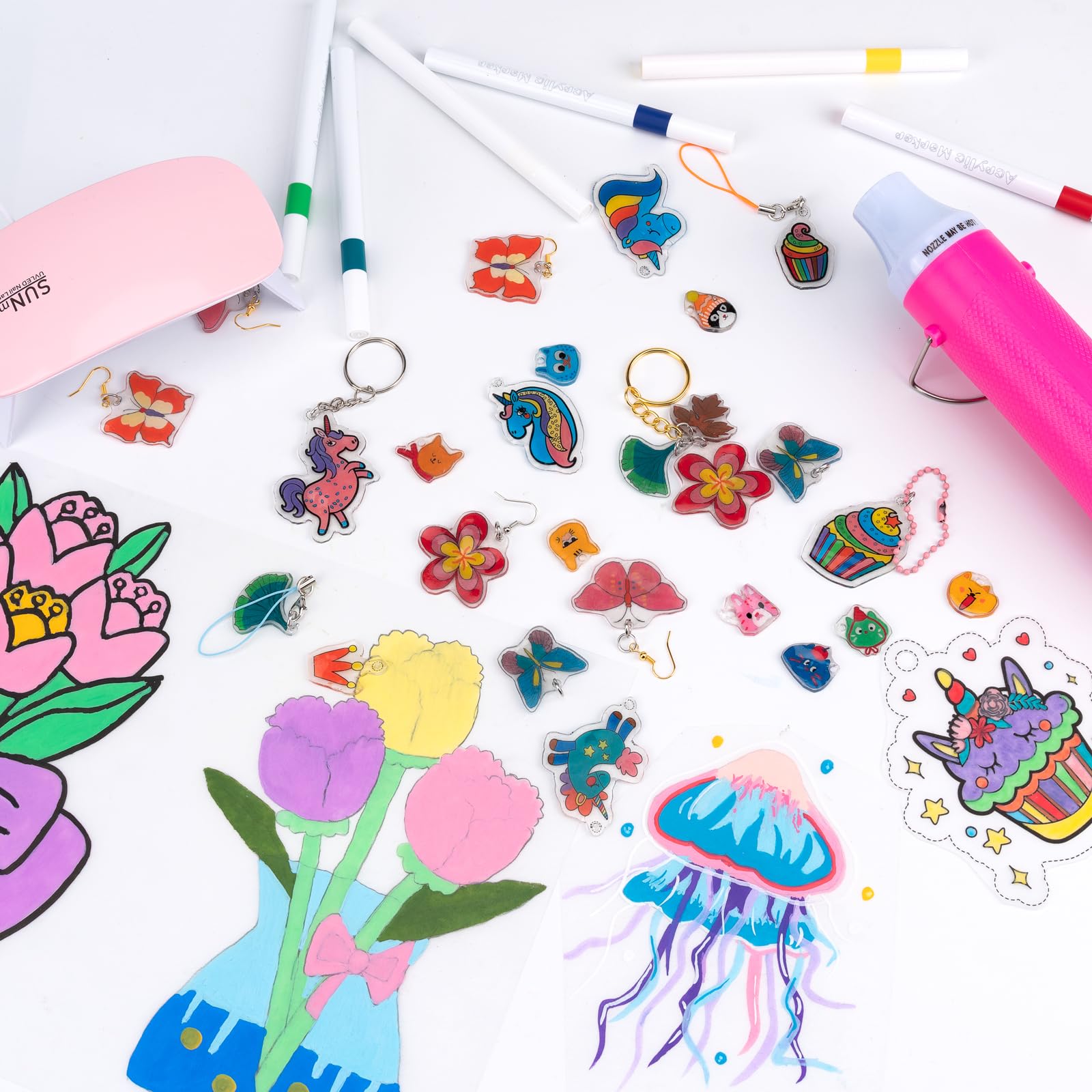 JelyArt Kit Plastique Fou 182 pièces – 20 feuilles de plastique dingue + Pistolet à air chaud + Résine UV + Lampe UV + Accessoires pour porte-clés – Shrink plastic sheets Film thermorétractable