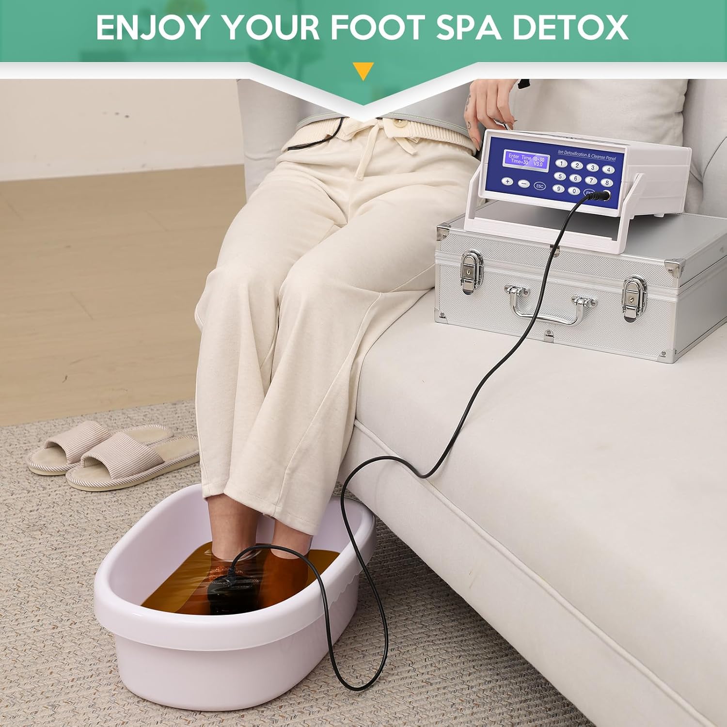 Person using the Ionic Detox Foot Bath Machine with feet in water