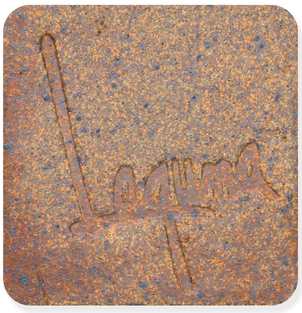 Fired clay sample showing a warm brown color with specks, indicative of reduction firing.