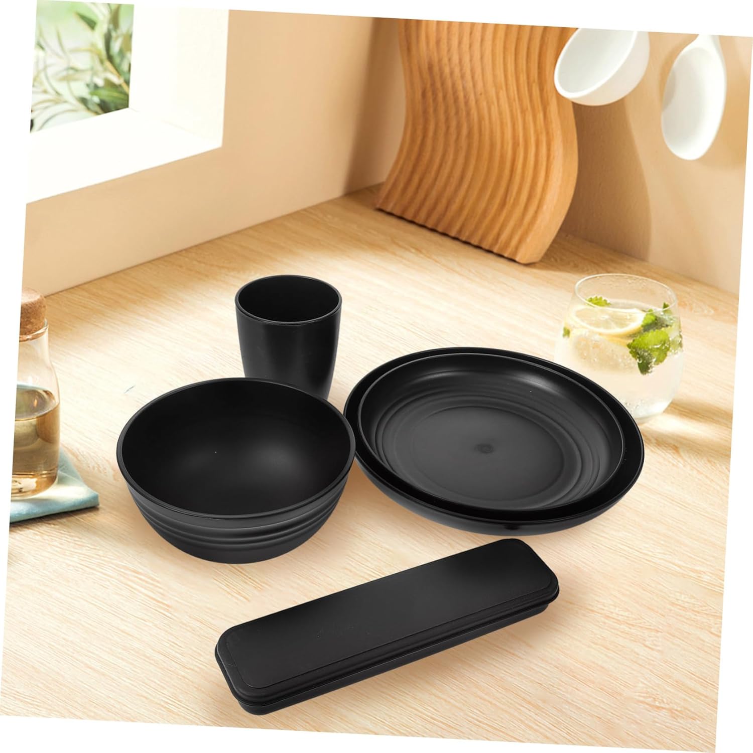 28-Piece Black Dinnerware Set Sturdy Camping Plates Bowls Cups and Utensils Reusable Cutlery for Parties and Outdoor Use for Picnics and Family Gatherings