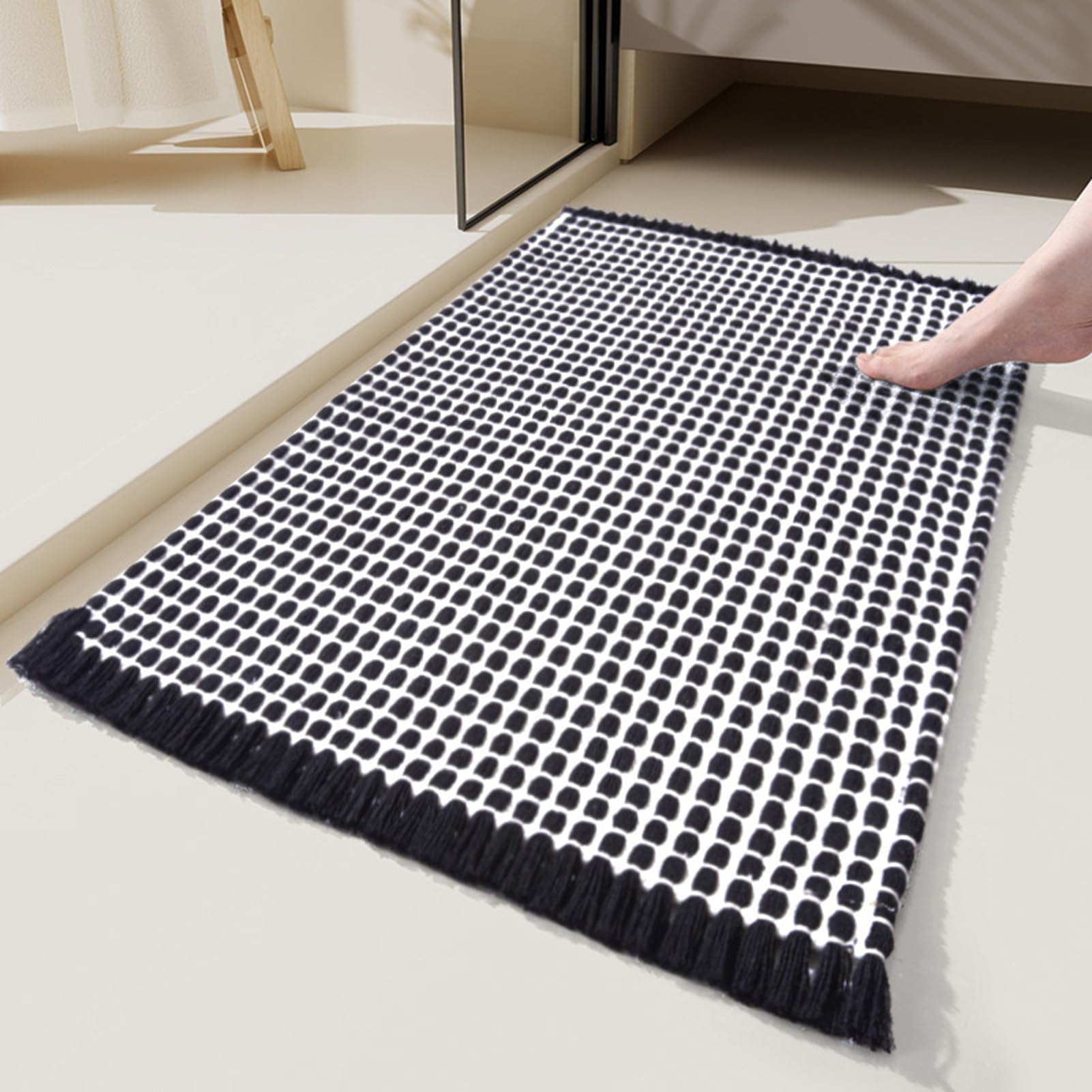 Photo 1 of Eanpet Black Bathroom Rugs with Tassels Soft Boho Rug Nonslip Bath Mat for Bathroom Mats Water Absorbent Solid Bath Shower Rug Washable Floor Mats Decoration for Bedroom Living Room,15.7" x 23.6"
