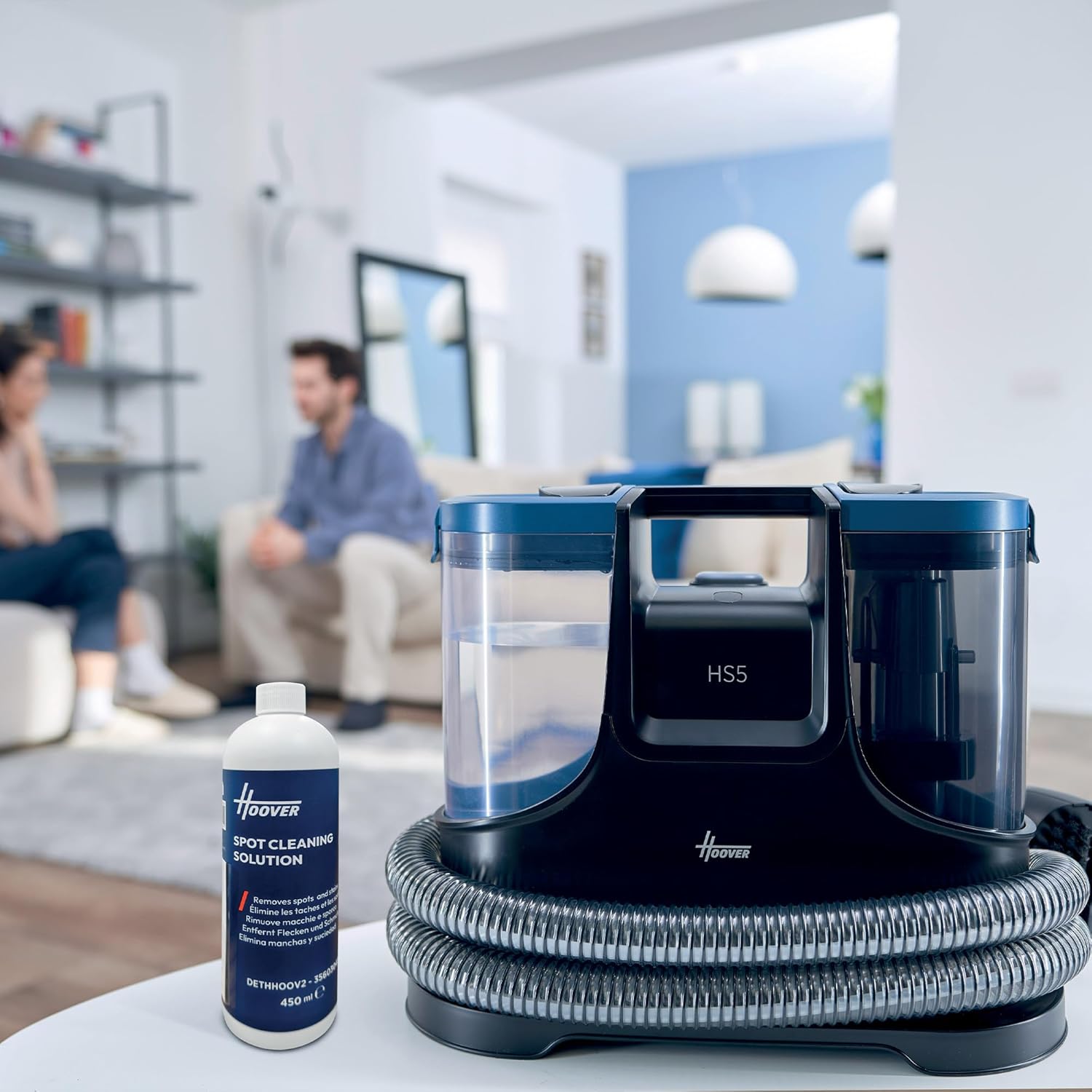 Hoover HS500 Stain Cleaner with a bottle of cleaning solution