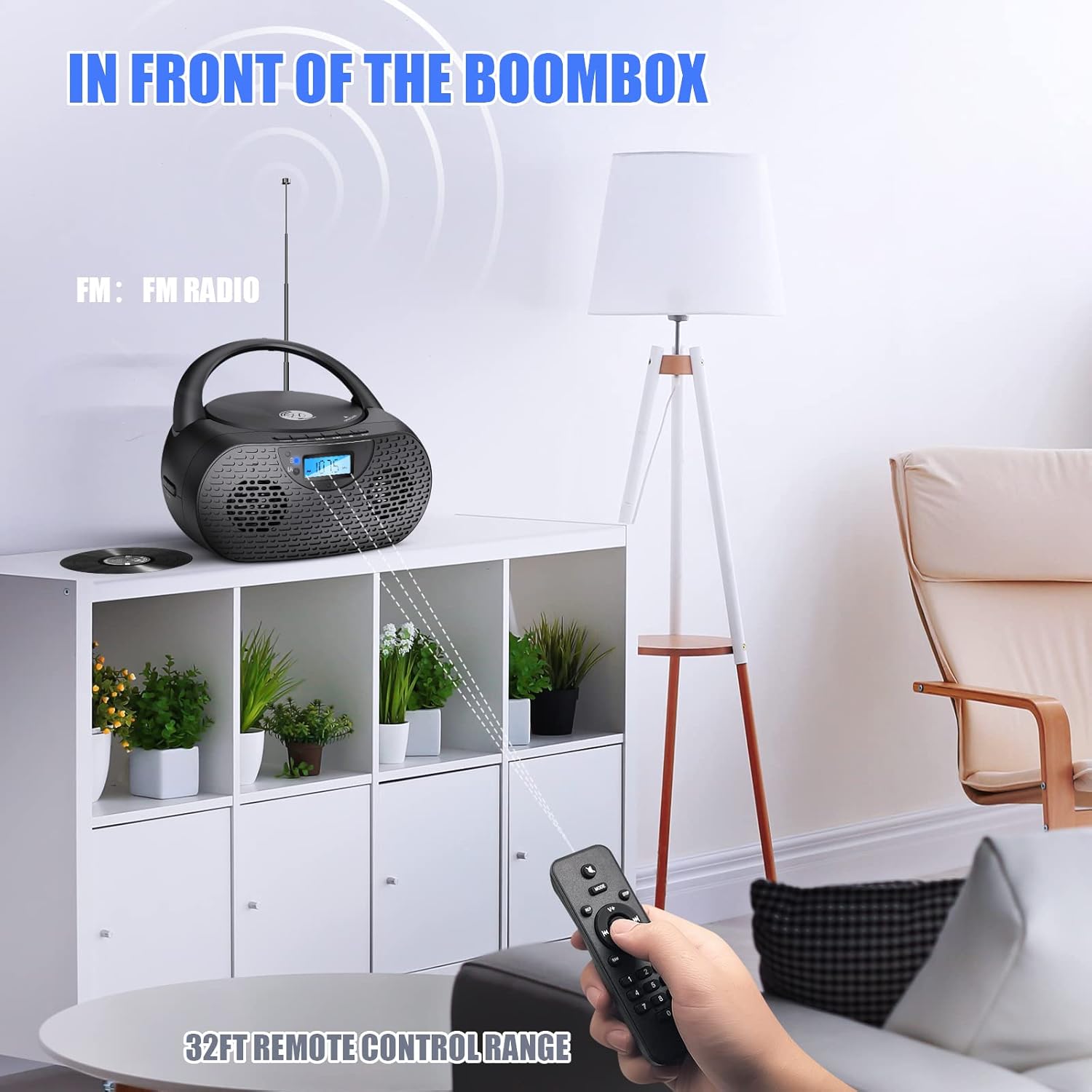 Herneum Boombox with extended FM antenna and remote control in use.
