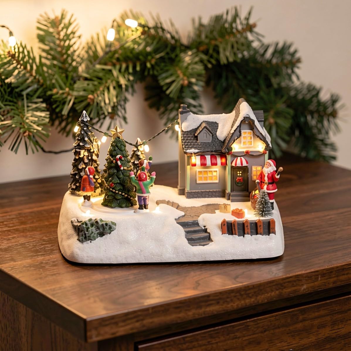 Weihnachtshaus aus Kunstharz mit Beleuchtung als Tischfigur