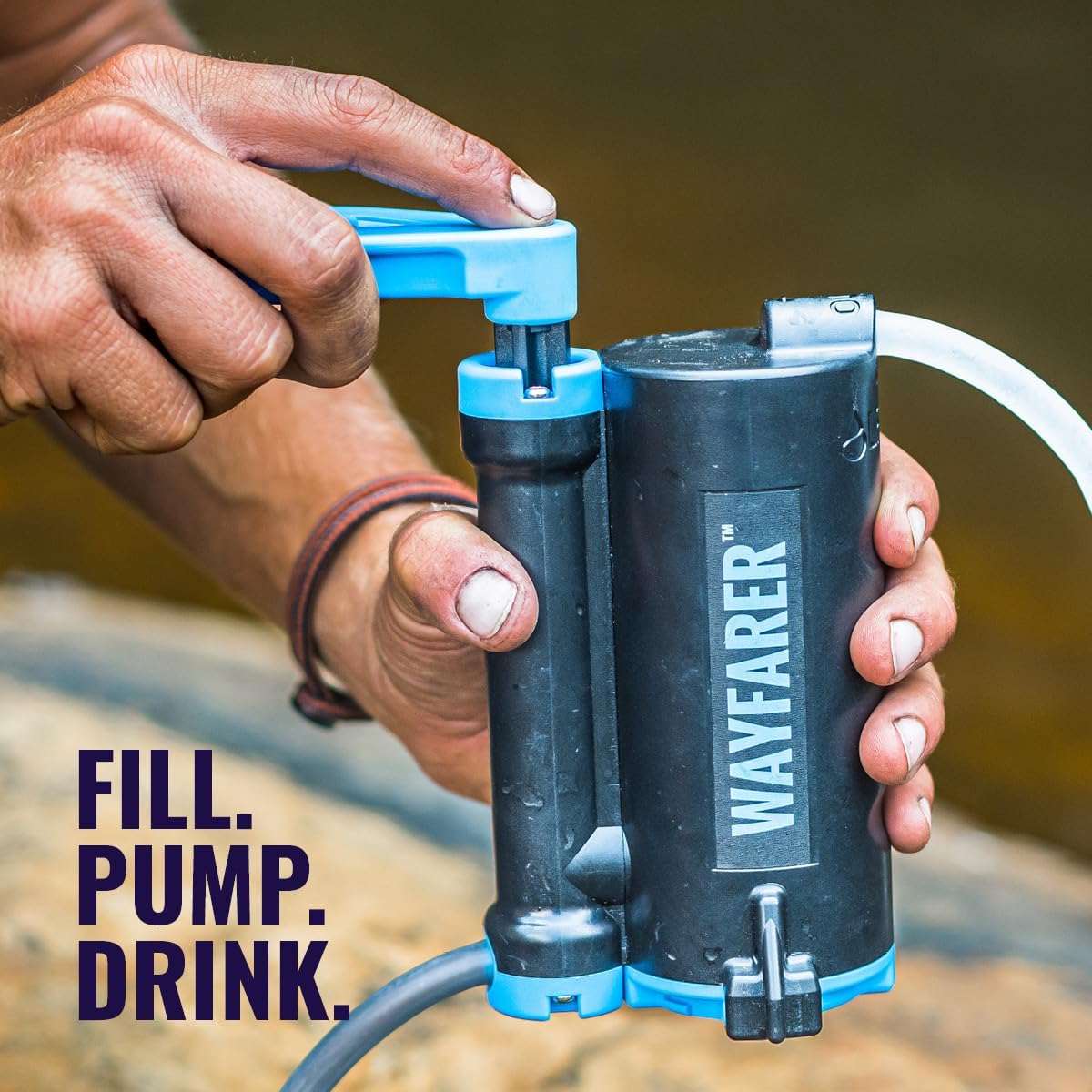 Close-up of hands operating the LifeSaver Wayfarer pump