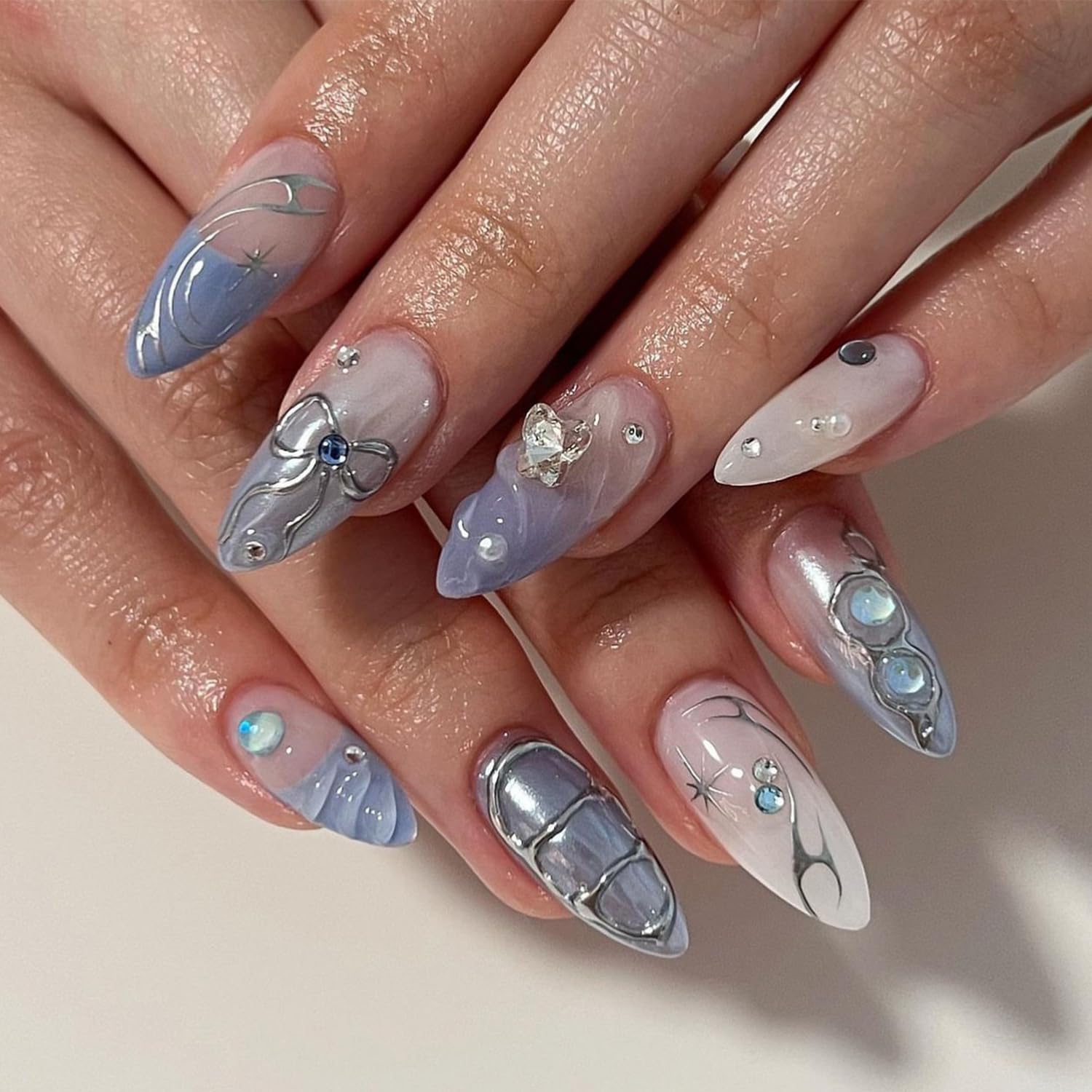 24Pcs Blue Press on Nails Almond Medium Fake Nails with Sliver Chrome Bow Charms Designs Stiletto Acrylic Nails Almond Shaped Y2K Glue on Nails Glossy