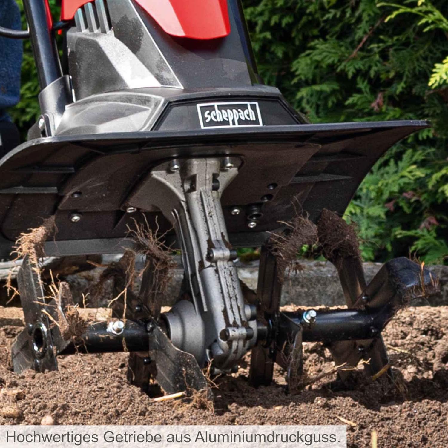 Close-up of the 16 steel blades of the Scheppach MTE380 tilling soil