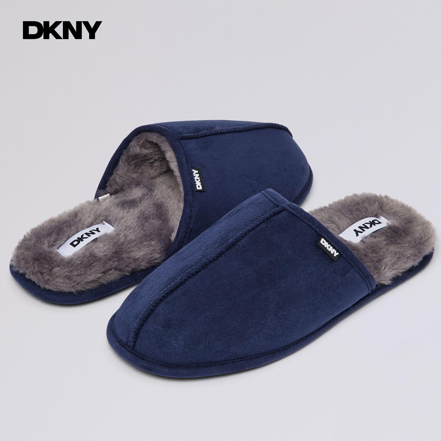 DKNY Kapcie męskie, wygodne, zamszowe kapcie dla mężczyzn z ciepłą podszewką ze sztucznego futra, pantofle, miękkie i oddychające, dostępne w kolorze czarnym, szarym, jasnobrązowym i granatowym