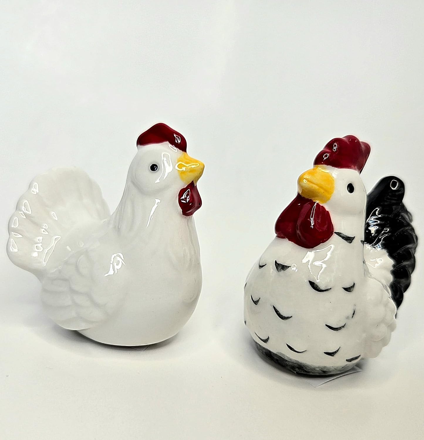 Rooster & Hen Mini Ceramic Salt & Pepper Shaker Set, 2.5 inches by 2.5 inches by 1.5 inches.