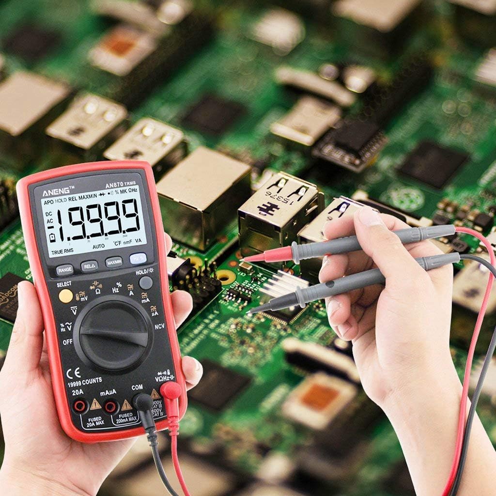 Person using ANENG AN870 Multimeter to measure on a circuit board