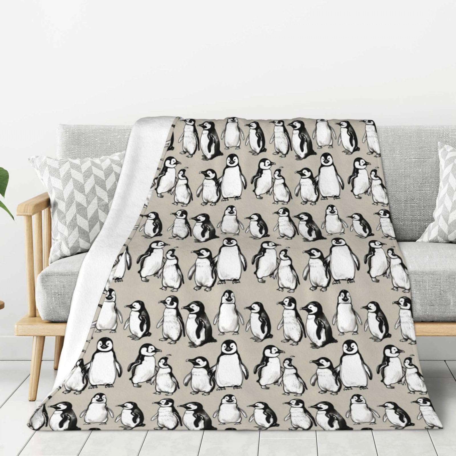 Plaid canapé pingouins idéal pour éliminer les pieds froids sur le lit ou en camping