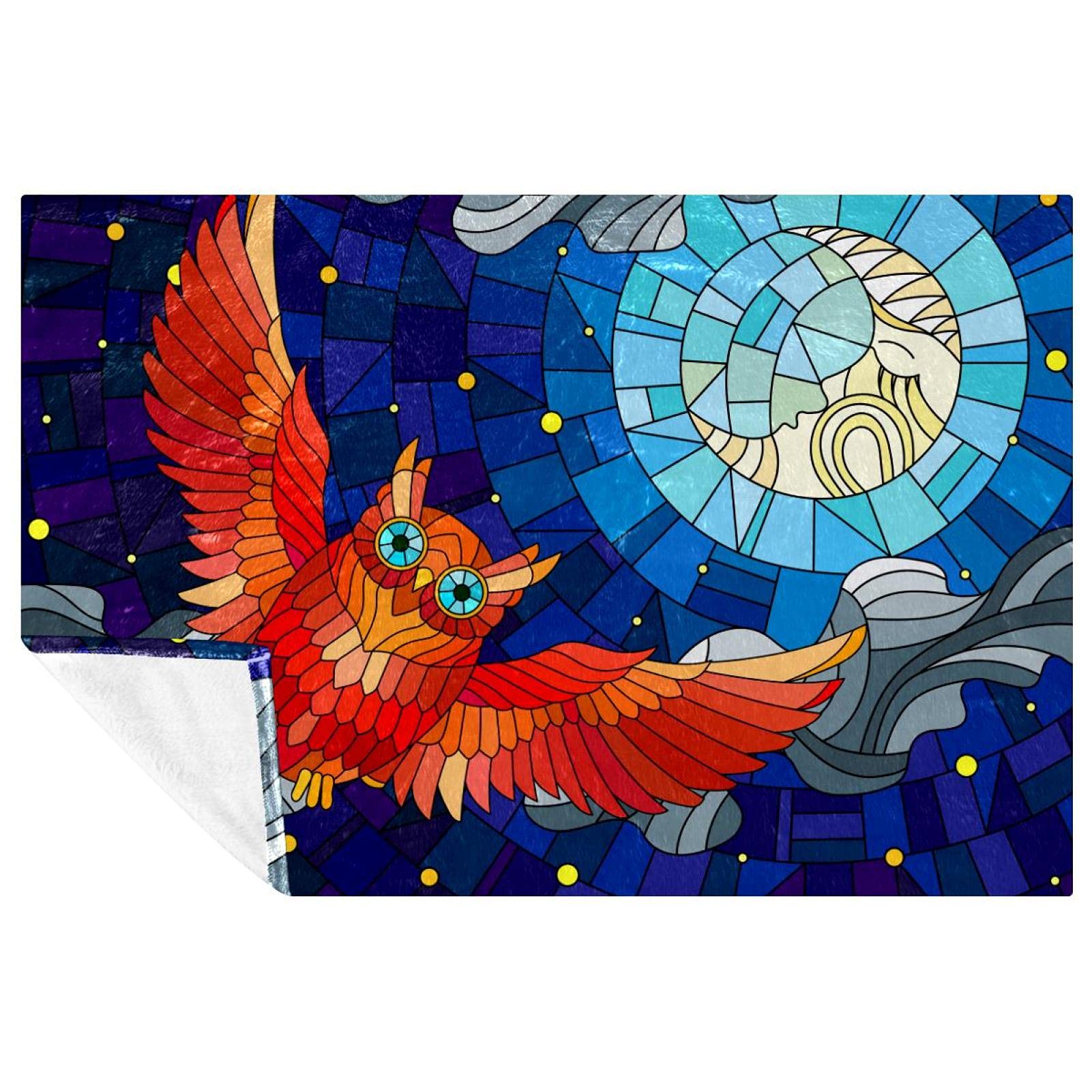 Couverture hibou bleu vitrail contre le froid sur le lit
