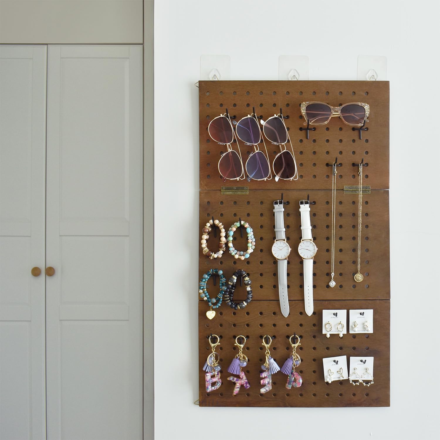 MOOCA Wall-Mountable Wooden Foldable 3-Panel Pegboard Jewelry Display Organizer with 48 Removable Black Hooks, Vertical or Horizontal Display, Ideal for Travel, Brown Color